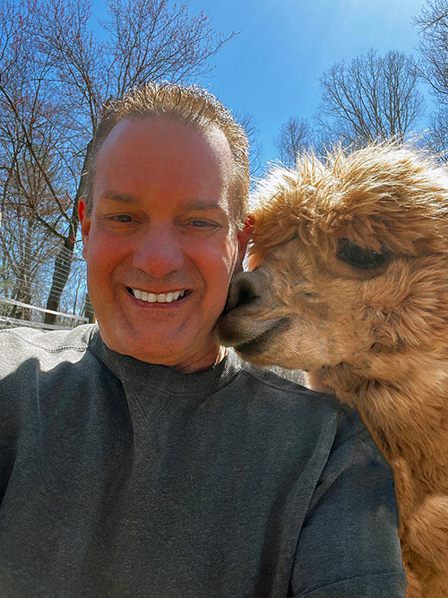 Kevin M. Cordeiro with Hermey the alpaca